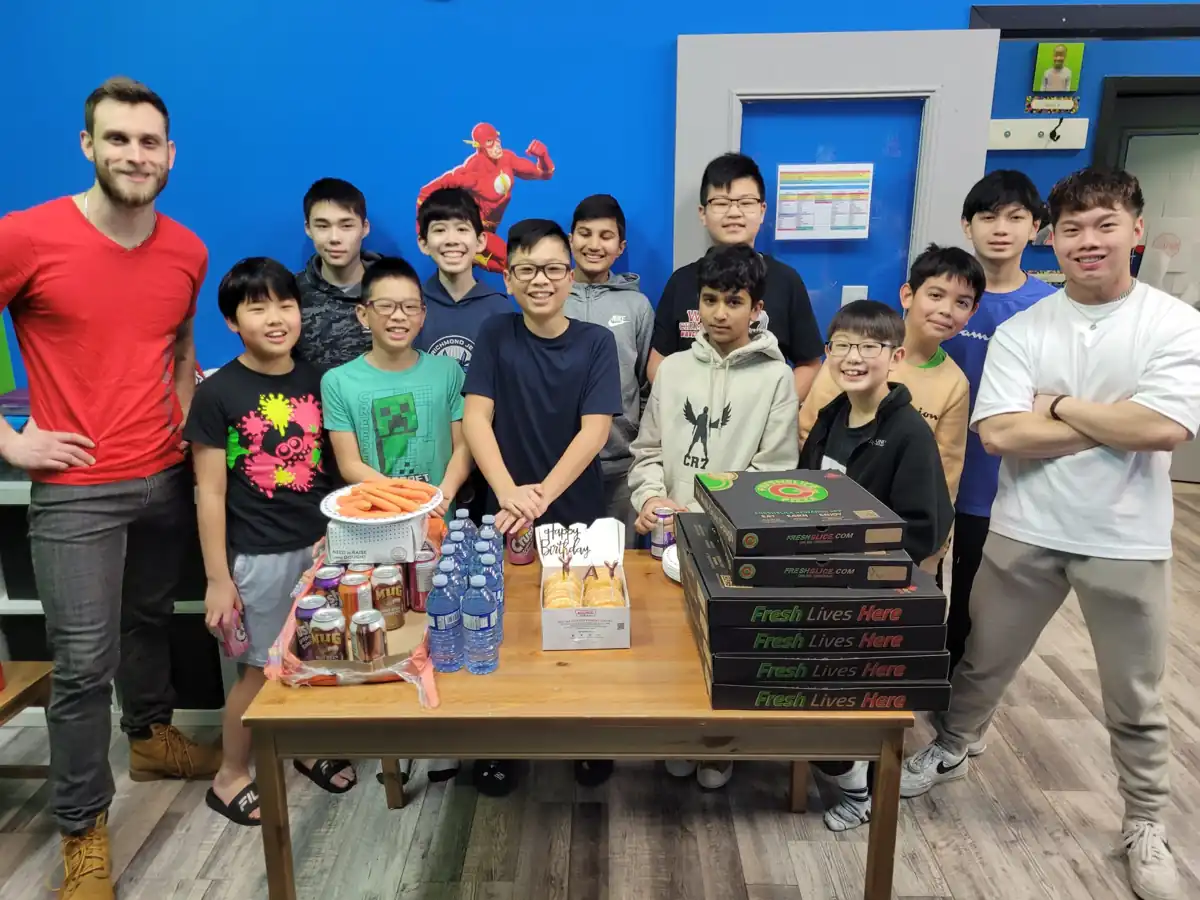 Kids celebrating a birthday party with their coaches at Rise Kicks Academy in Richmond BC
